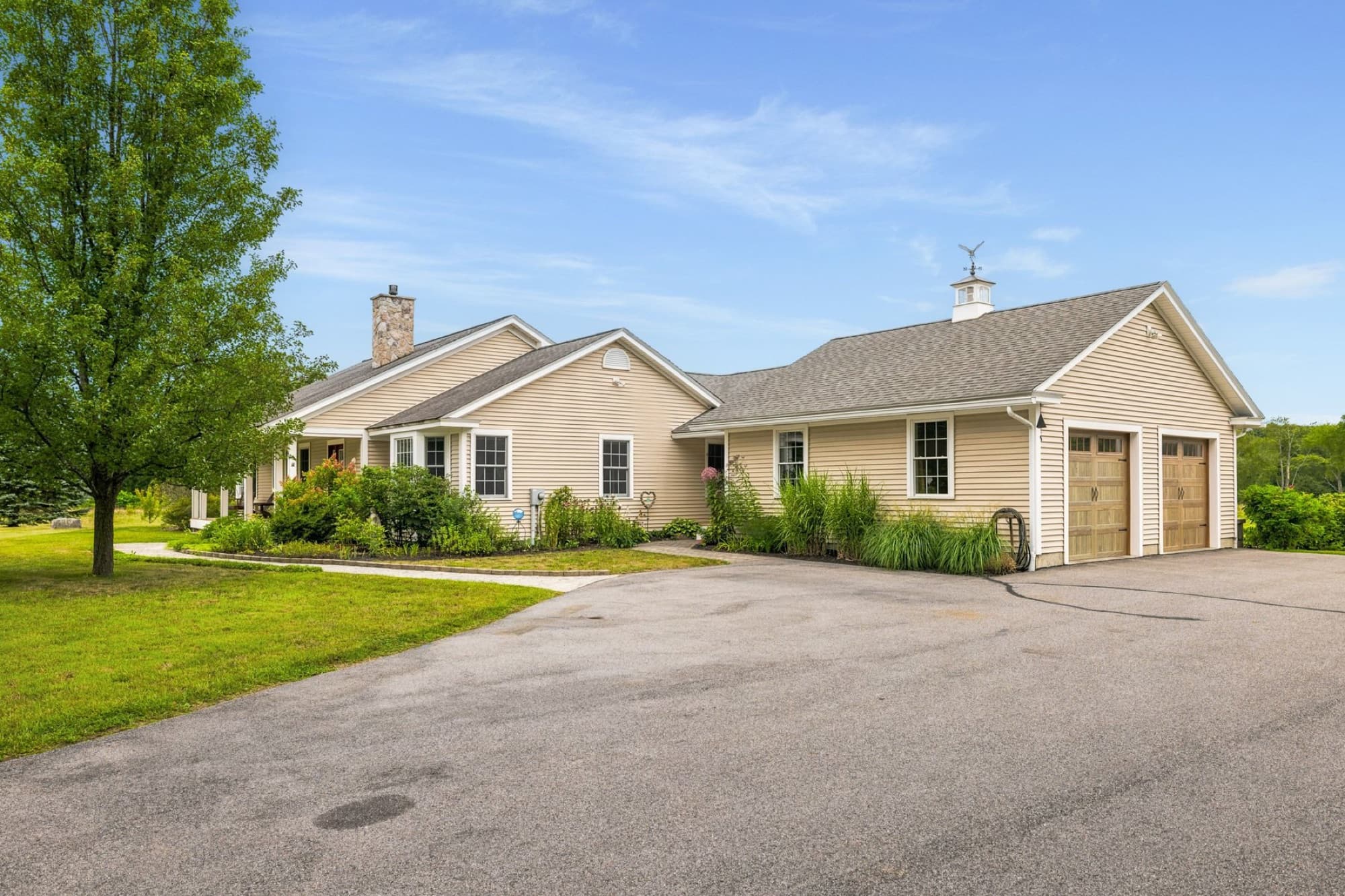The house and the attached 2-car garage from the paved driveway